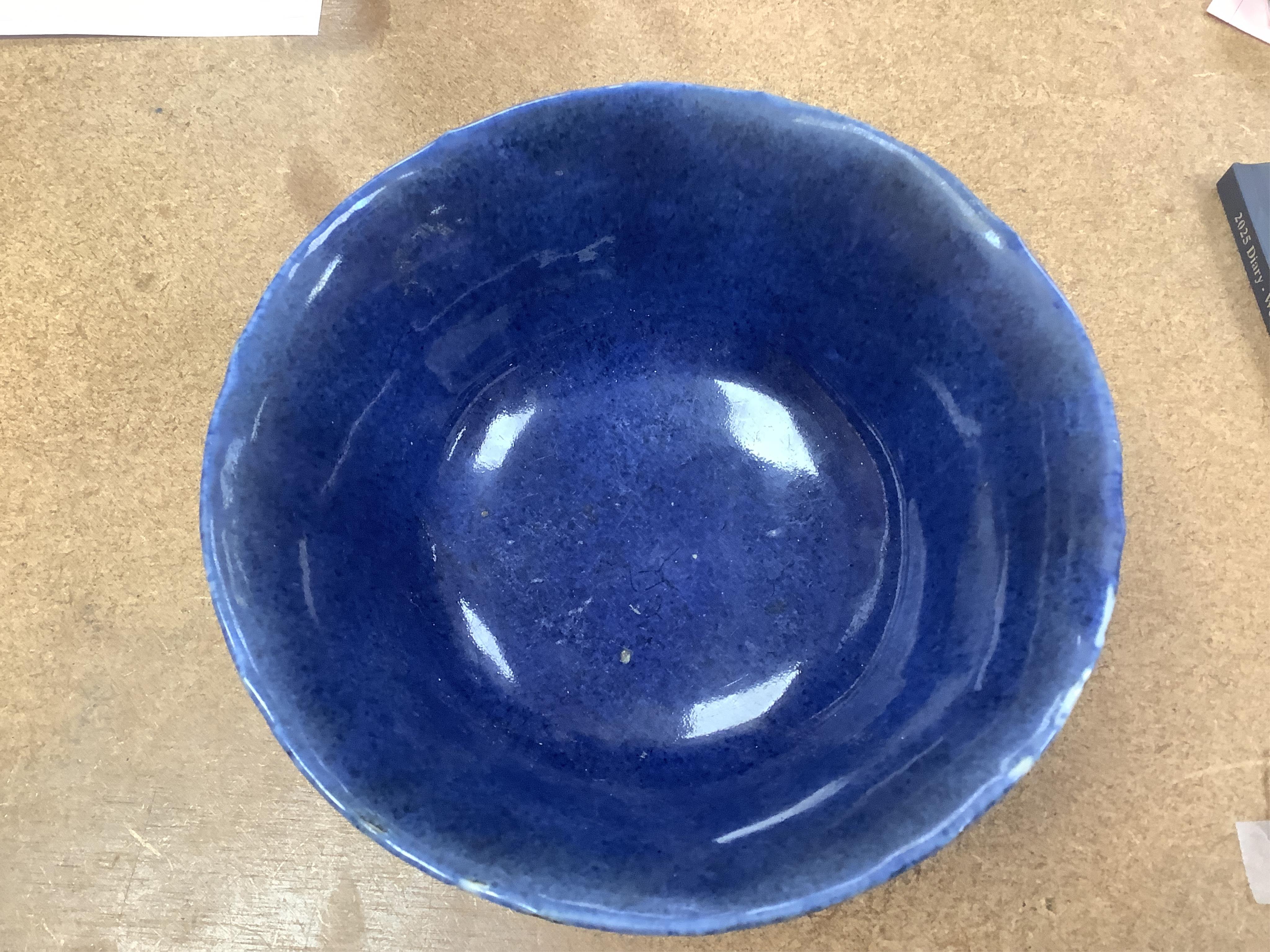 A Chinese powder blue bowl, early 18th century and a Chinese blue and white prunus jar - tallest 13cm. Condition - fair